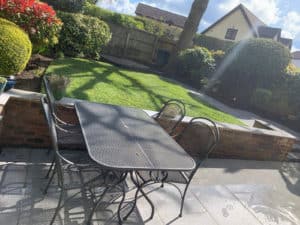 outdoor furniture on porcelain patio with lawn in the background