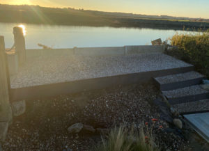 sunset over the river viewed from gravelled patio area