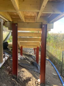 steel supports beneath raised decking structure