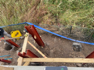 early stages of constructing a raise deck with steels in place and timber being measured